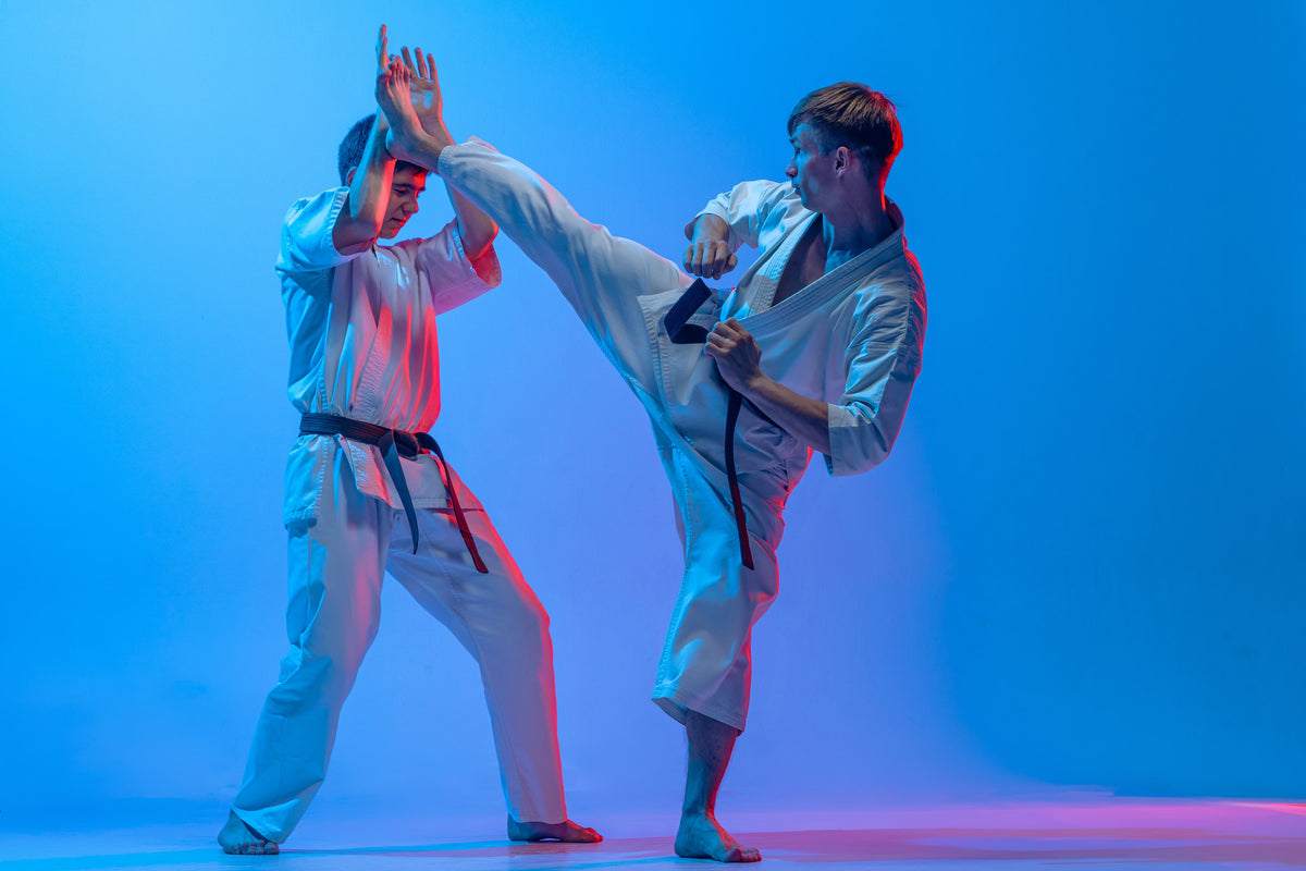 Two Full contact Karate practitioners sparring in their full contact karate dogi